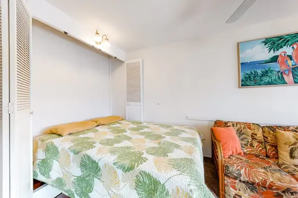 Cozy sleeping area with tropical touches creates a warm and relaxing setting for a restful night