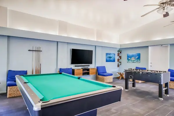Community game room with pool tables.
