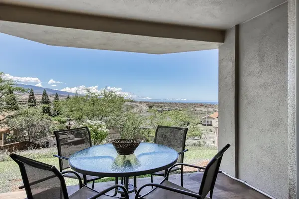 Private lanai with seating overlooking the ocean.
