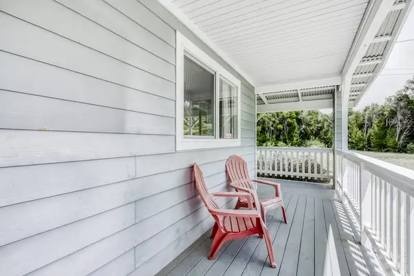 Inviting Front Lanai With Cozy Seating
