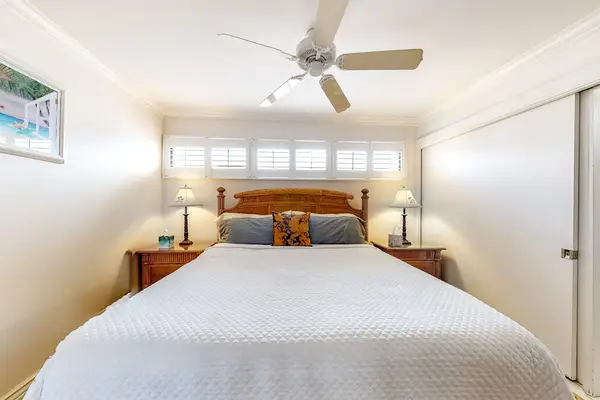 Master bedroom with king bed and an en-suite bathroom.