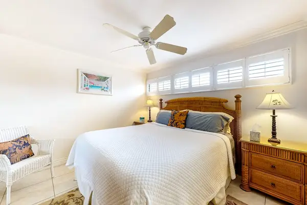 Master bedroom with king bed and an en-suite bathroom.