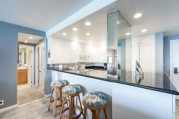 Barstools at kitchen counter for extra seating or for your sous chef.