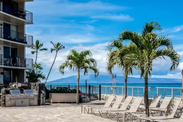 Hololani Resort Pool so close to the beach you can hear the waves crash ashore.