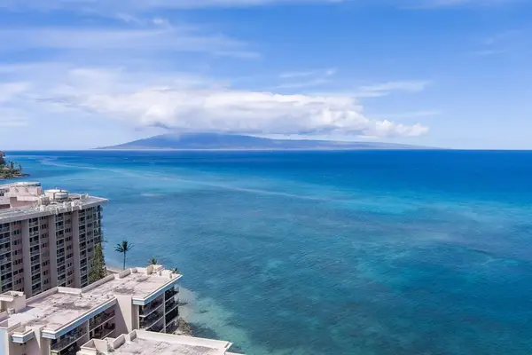 Aerial view of Hololani Resort against the turquoise waters of the Pacific Ocean