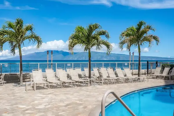 Hololani Resort Pool so close to the beach you can hear the waves crash ashore.