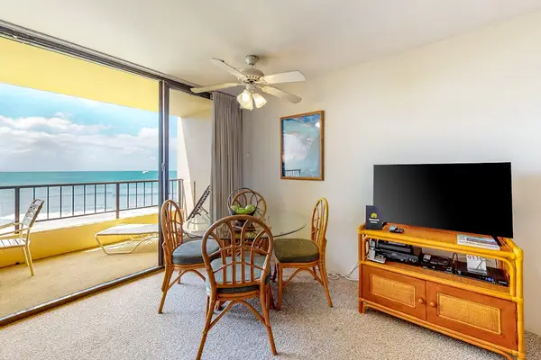 Dining room table for four with views from the lanai.