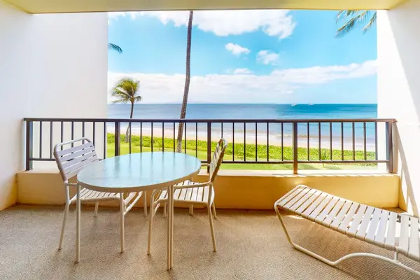 Views of the turquoise waters of the Pacific Ocean washing up on the white sandy beaches while the palm trees sway in the wind from your private lanai.  Relax in your chaise lounger or enjoy your morning coffee at your table and chairs.