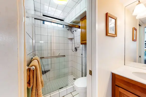 Refreshing Bathroom Suite Featuring A Walk-In Glass Shower