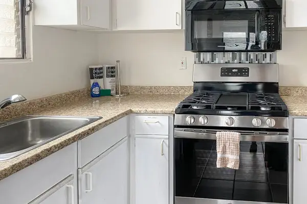 Fully equipped kitchen with generous counter space for preparing your favorite meals with ease