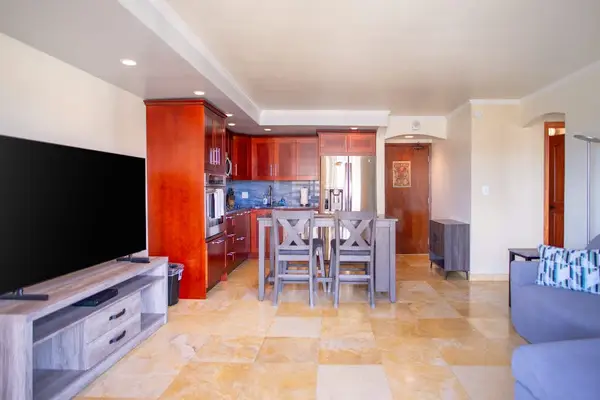 Open living, dining, and kitchen layout creates a spacious and inviting space for relaxing or entertaining.