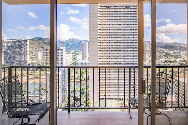 Private balcony with seating offers beautiful Waikiki skyline and mountain views, perfect for morning coffee or evening relaxation.