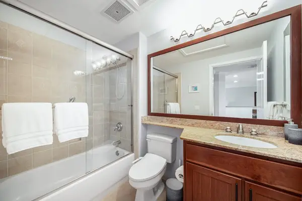 Guest bathroom with tub/shower combo.