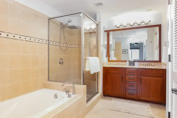 Master en-suite bathroom with double sinks, garden tub and walk-in shower.