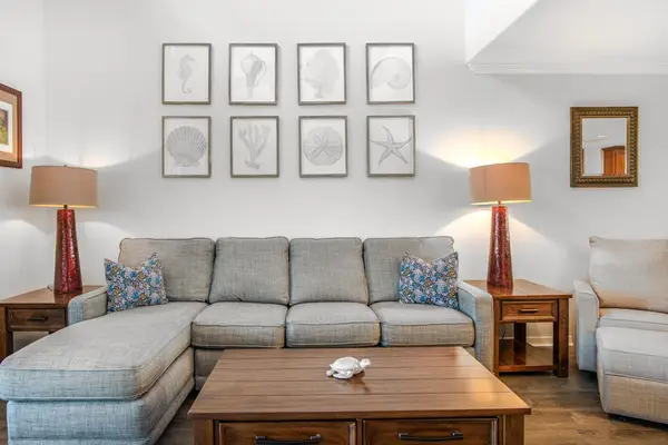 Living room with plenty of seating with the sectional couch and a flat screen tv.