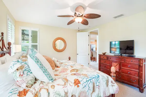 Bright primary bedroom with a cozy reading nook