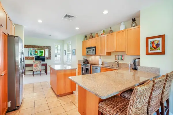 Fully equipped kitchen with island seating and modern appliances