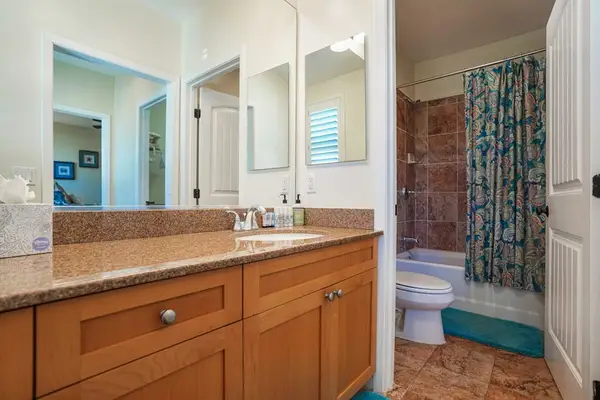 Ensuite bathroom with dual vanity, connected to the Queen bedroom