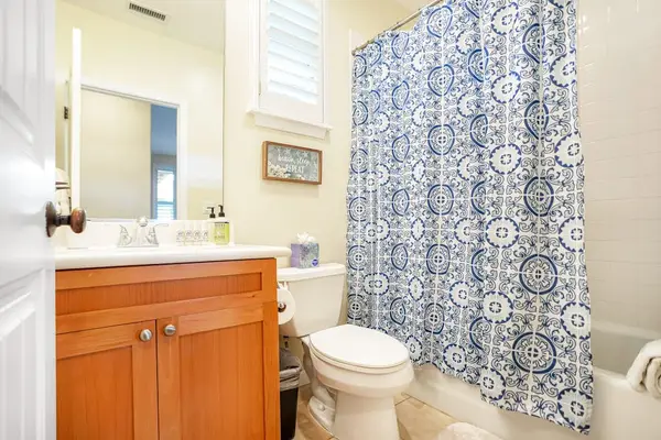 Guest bathroom with a walk-in shower and vanity