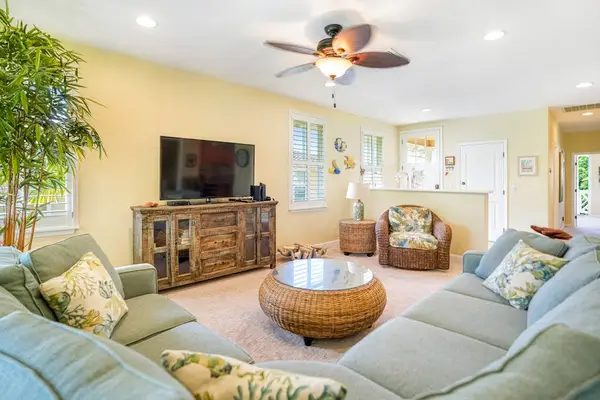 Bright living room with garden views and comfortable seating