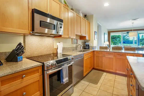 Kitchen featuring stainless steel appliances and ample counter space