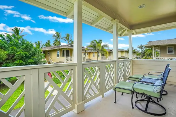 Screened lanai with rocking chairs, ideal for relaxing outdoors