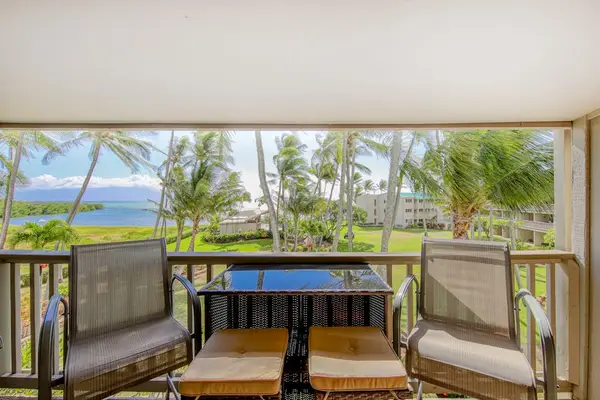 Bright balcony with dining seating offers comfort for casual meals and quiet mornings outdoors