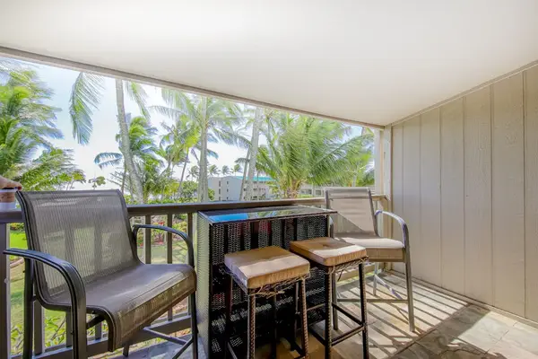 Comfortable balcony with dining space offers a relaxing outdoor setting for every meal