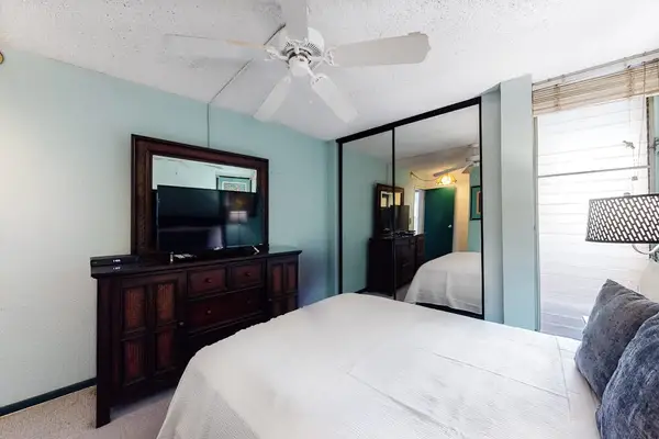 Master Bedroom with king bed and a flat screen tv.