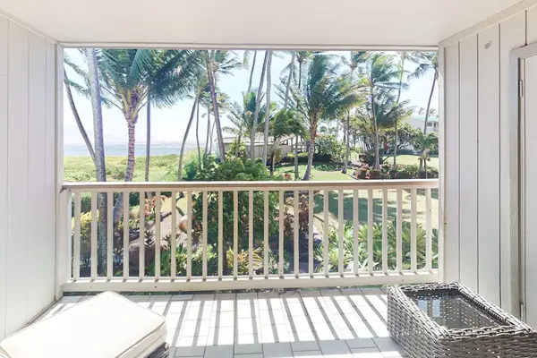 Balcony seating overlooks tropical grounds and sparkling Pacific waters nearby