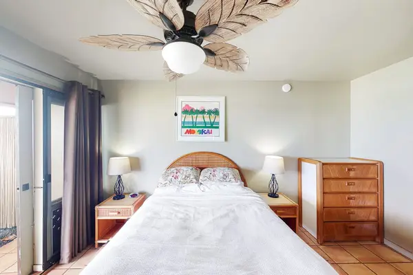 First bedroom featuring comfortable queen bed with fresh linens for restful sleep