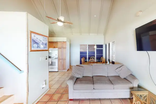 Comfortable seating area with television for relaxing after memorable island adventures together