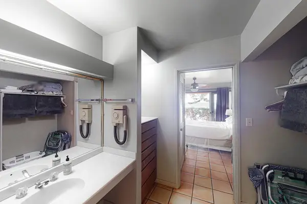 Spacious bedroom with walk-in closet and private sink for everyday convenience daily