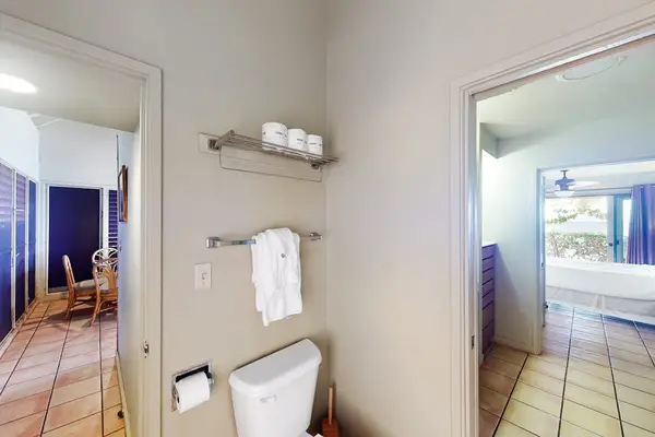 Modern full bathroom featuring spacious vanity and thoughtfully arranged guest essentials throughout