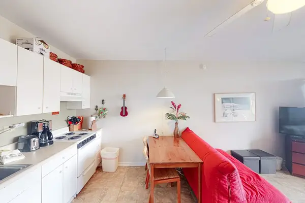 Bright studio combines kitchenette dining area and comfortable sleeping space