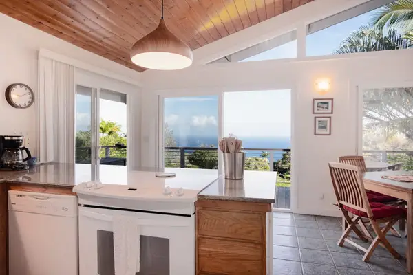 Bright Open-Concept Kitchen with Vaulted Wood Ceilings & Ocean Views