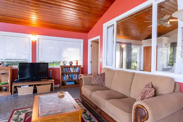 Media Nook featuring Flat-Screen TV, Bookshelf & Wood Panel Ceilings