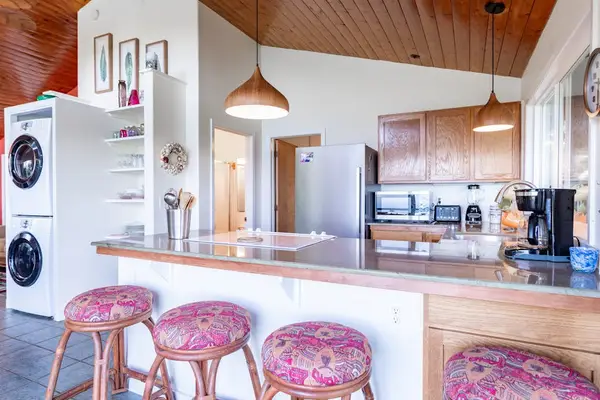 Kitchen Breakfast Bar with In-Unit Stacked Washer & Dryer