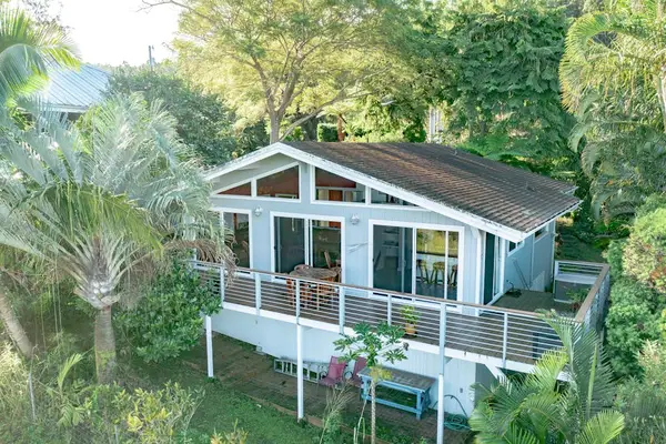 Full Aerial View of House Profile, Elevated Deck, & Tropical Canopy