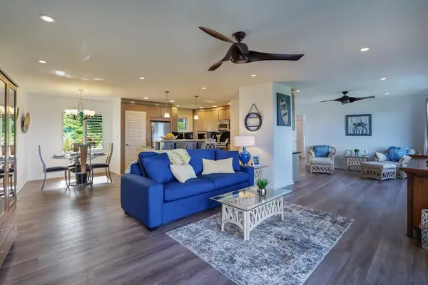 Spacious living area with plush blue seating