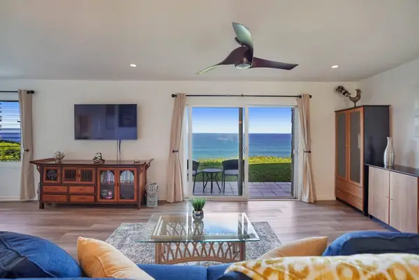 Open living area with tropical décor and natural light