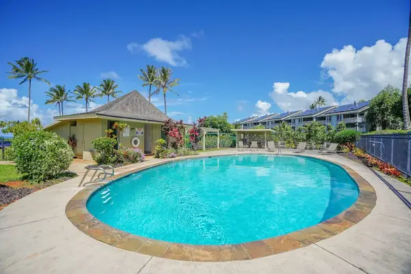 Sparkling resort pool surrounded by palm trees