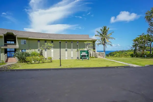 Exterior view of the building surrounded by open lawn