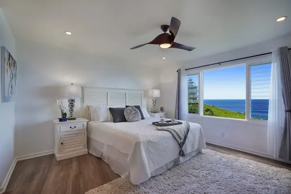 Cozy bedroom with an ocean view from the window