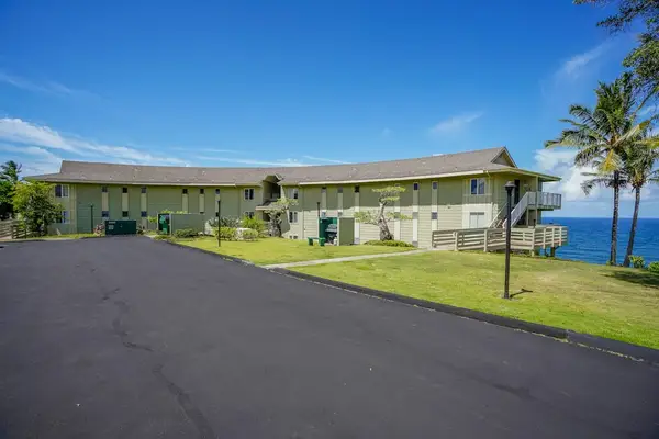 Exterior view of the building with nearby parking