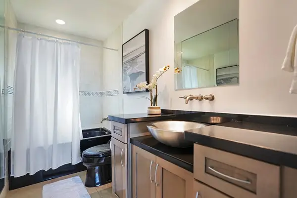 Guest bathroom with a stylish vanity and mirror