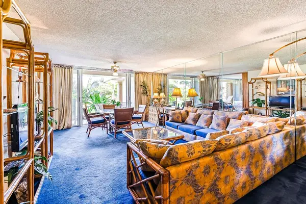 Stretch out in the spacious living room with comfortable seating and island-inspired décor.