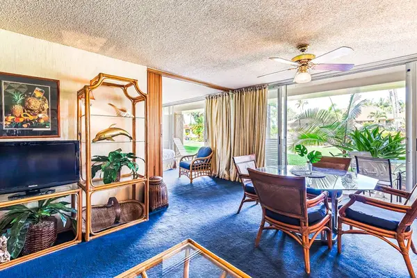 Share memorable meals in the open dining area overlooking the tropical grounds.