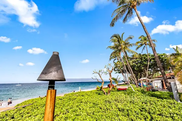 Take in the refreshing ocean breeze from the beautifully maintained seaside lawn.