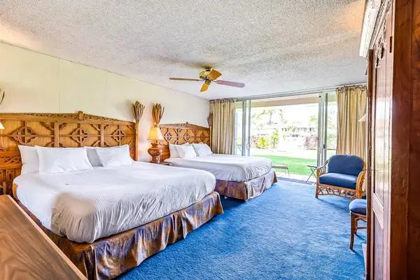 Sleep comfortably in a spacious bedroom featuring two king beds.